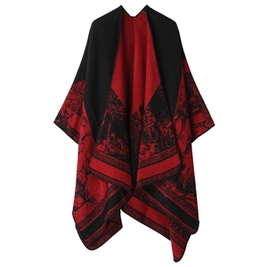 Detail of red and black knit shawl featuring an intricate forest and deer scenic pattern
