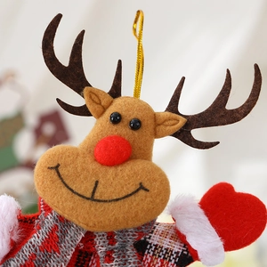 Charming reindeer Christmas plush ornament with red plaid scarf on a tree