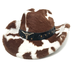 Detail of cow print faux fur cowboy hat with leather band and gold bull head buckle