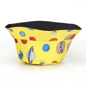 Detail of double-sided fisherman hat with yellow planet print and black inner lining