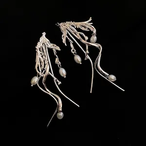 Minimalist silver tassel pearl earrings featuring a fluid streamline metal design for women