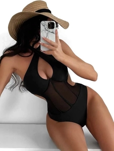 Detailed view of black one-piece swimsuit featuring mesh patchwork and cross-neck cutout