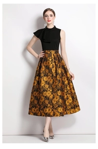 Detail of elegant ruffled collar and luxury gold floral jacquard texture on the maxi dress