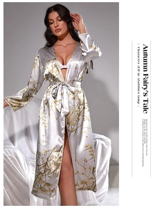 Detail of silver silk satin robe with elegant brown flower patterns and waist tie