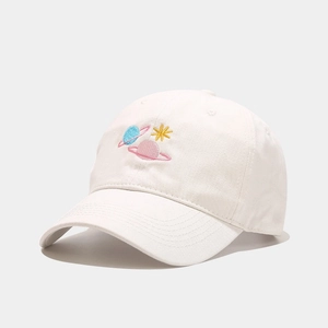 Close-up of asteroid embroidery on an off-white cotton canvas baseball cap