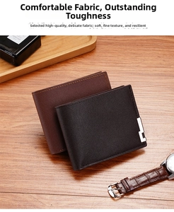 Close-up of black and dark brown slim bi-fold leather wallets with metallic trim details