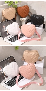 Collection of heart-shaped quilted crossbody bags in beige, brown, black, white, and pink colors
