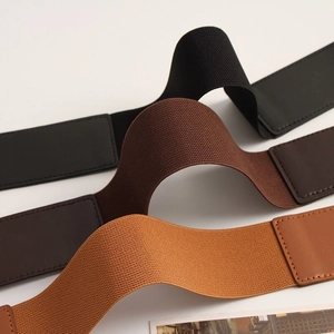 Detailed view of elastic waist belts in black, dark brown, and tan with PU leather ends