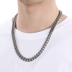 Close-up of 12mm silver stainless steel Miami Cuban link chain necklace on model