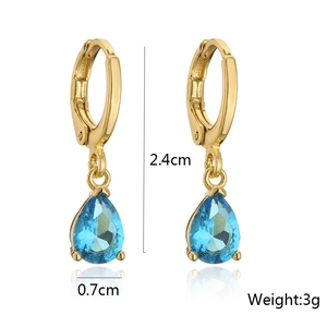 Detail showing 2.4cm gold drop earrings with blue crystal and technical dimensions