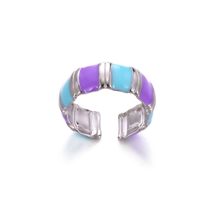 Detailed shot of open silver ring featuring alternating purple and blue enamel stripes