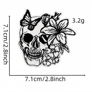 Detail shot of punk skull and lily embroidery patch with 7.1cm size measurement