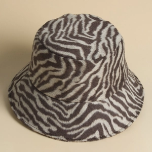 Winter faux fur zebra print bucket hat in brown and beige with a soft plush texture