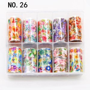 Detailed view of ten assorted floral nail art foil rolls in a clear storage organizer