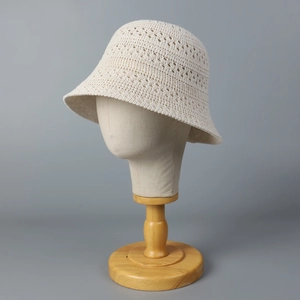 Women's cream white hollow knit bucket hat with breathable crochet pattern for summer