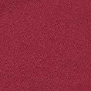 Vue macro détaillée de la texture du tissu en maille rouge foncé et structure fine