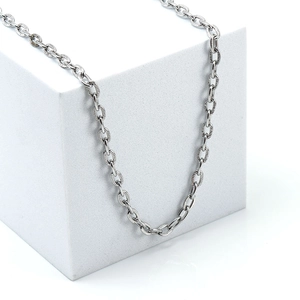 Silver 304 stainless steel embossed O-chain necklace displayed on a white cube prop