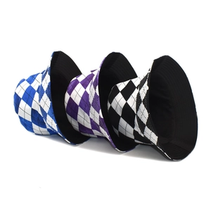 Unisex reversible checkerboard bucket hats in blue, purple, and black-and-white patterns