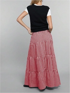 Back view of a tiered red and white plaid maxi skirt with a high-waisted A-line silhouette