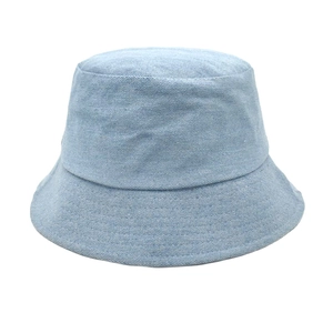 Detailed macro view of light blue denim fabric texture on a casual bucket sun hat