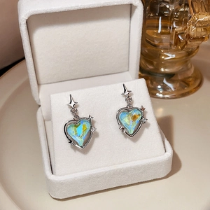 Blue and yellow crystal heart earrings with silver cross pendant in a jewelry box