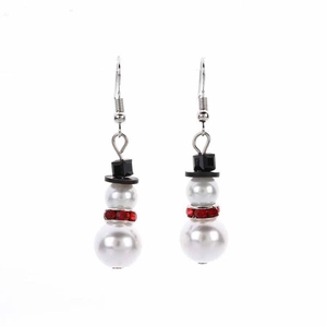 Detail of cute snowman earrings featuring white pearls and red rhinestones for Christmas