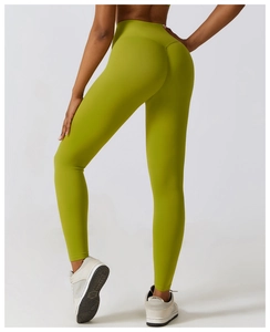 Rear view of high-waisted olive green yoga pants with seamless lifting design