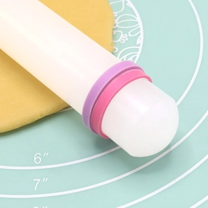 9-inch white PP rolling pin with colorful thickness rings on a silicone baking mat