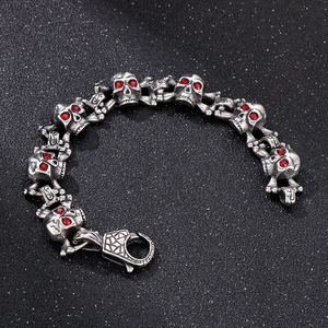 Hip hop stainless steel skull bracelet with red rhinestone eyes and lobster clasp