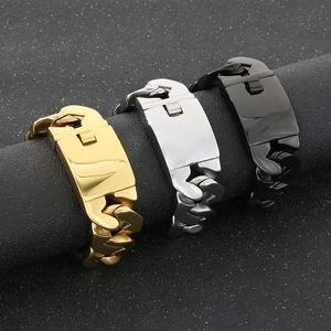 Close-up of heavy industrial cuban link bracelets in gold, silver and black finishes