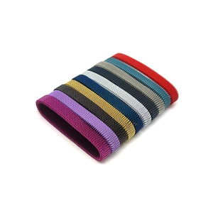 Close-up of flexible stainless steel mesh bracelet bands in ten assorted metallic colors