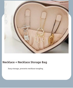 Macro view of heart-shaped PU leather jewelry box with necklace hooks and pocket