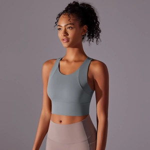 Close-up detail of grey seamless sports bra with wide straps and high elastic dry fit fabric