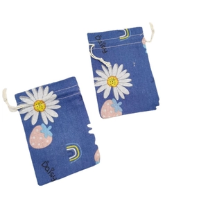 Floral cotton drawstring pouch set featuring daisy strawberry and rainbow patterns