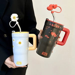 Handheld large ceramic mug with straw featuring daisy and love heart patterns