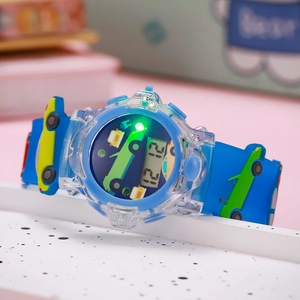Close-up of blue children's digital watch featuring cartoon car designs and green backlight