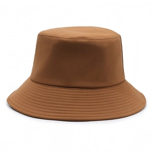 Classic caramel cotton bucket hat with parallel stitched brim and minimalist flat top