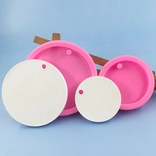 Detail showing pink silicone round pendant molds with white resin finished crafts