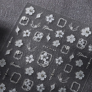 3D embossed white flower nail stickers with vintage frames and elegant petal designs