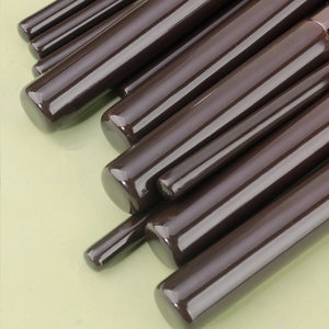 Detailed view of polished dark brown wooden handles of the 11-piece makeup brush set