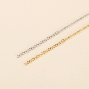 Detailed macro view of high-quality gold and silver metal jewelry extender chains