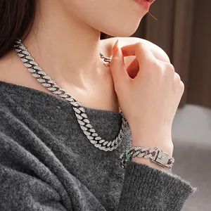 Iced out silver Cuban link chain necklace and bracelet set with sparkling rhinestones