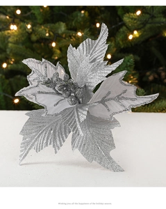 Detail of silver glitter artificial Christmas flower decoration on festive background