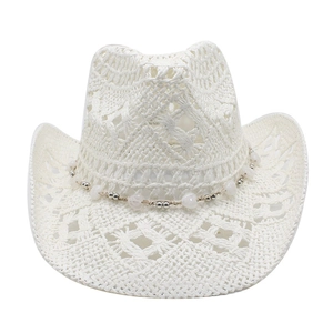 Detail of white hollow woven straw cowboy hat with heart-shaped beaded decorative band