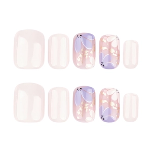 Press-on toe nails with light pink floral designs and gold foil accents on white background
