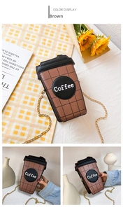 Detail of coffee cup shaped crossbody bag in brown PU leather with golden chain strap