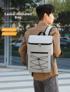 Outdoor insulated cooler backpack in grey with reflective strips shown on male model