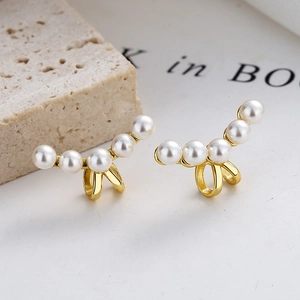 925 silver pearl ear cuff featuring five white pearls on a gold-tone French curved base