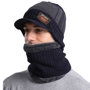 Detail of winter knitted beanie and neck warmer set with sport leather patch and fleece lining