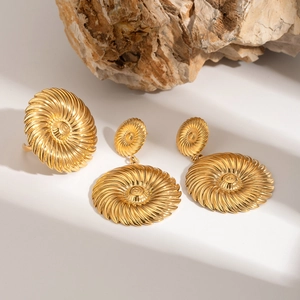 18k gold stainless steel double-layer flower earring and ring set on stone texture